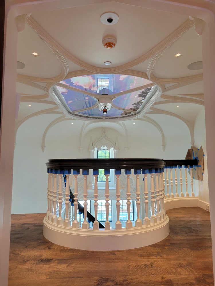 Video dome integrated above a chandelier fixture