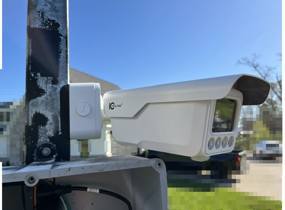 License plate recognition camera mounted on a gated entrance